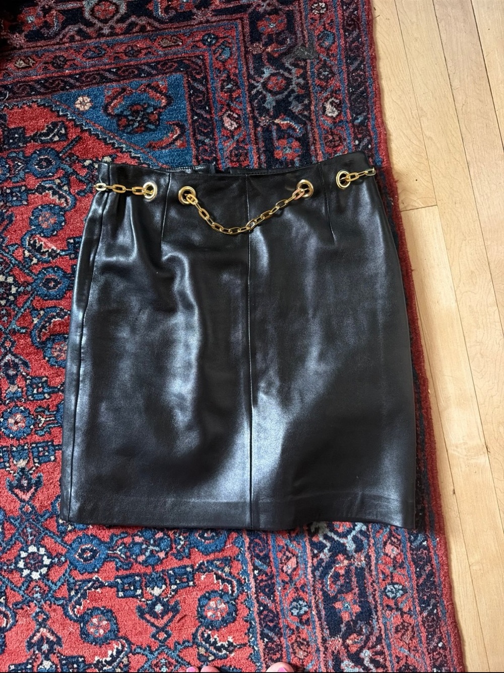 Black Leather Mini Skirt with Gold Chain Detail